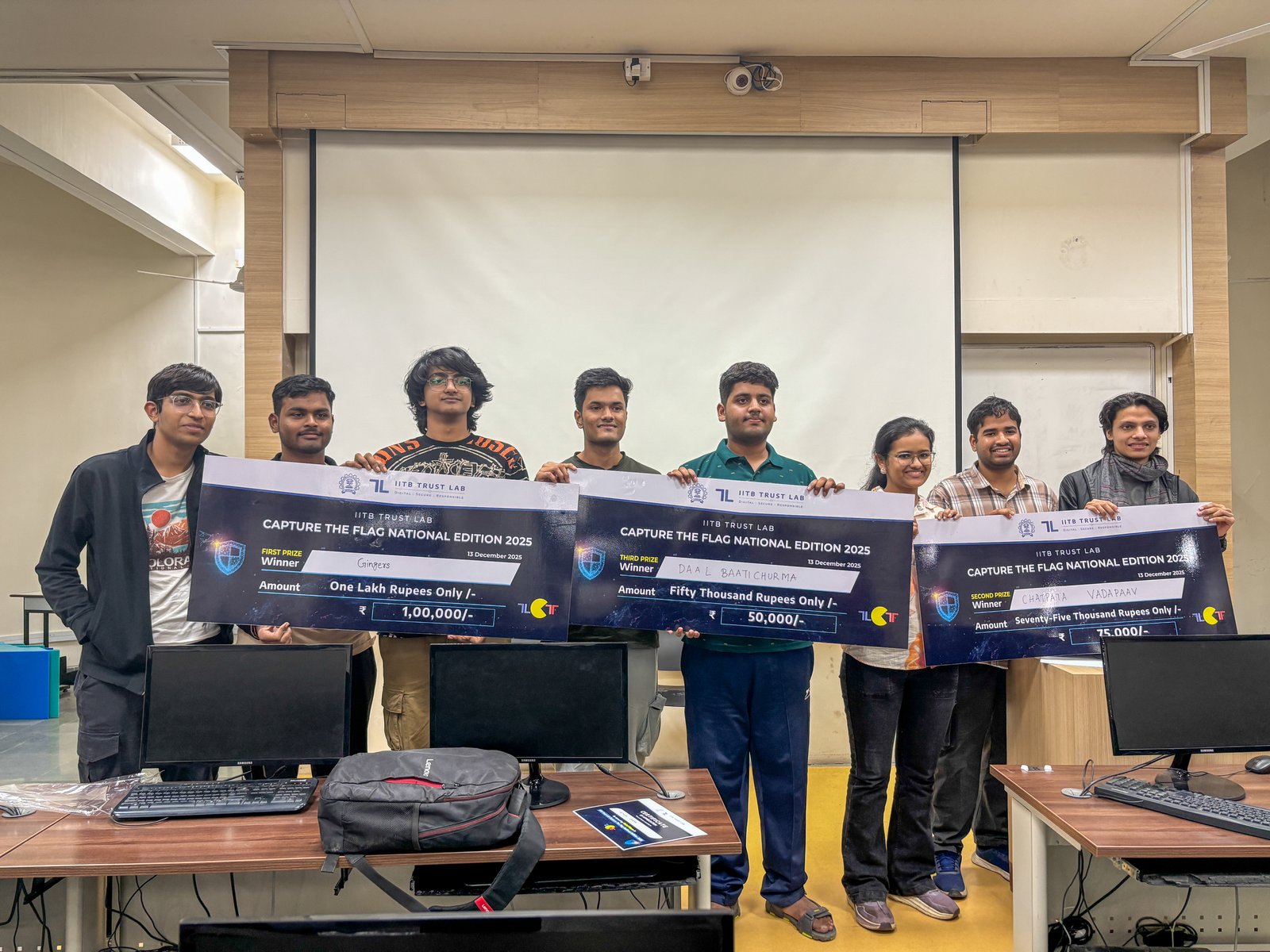 Mumbai, India: December 16, 2025: IIT Bombay’s Trust Lab successfully concluded the grand finale of its national-level cybersecurity competition Capture The Flag (CTF) today at its Powai campus. The event brought together some of India’s most promising young cybersecurity minds for a full-day challenge designed to mirror real-world digital threat scenarios.

 A Capture The Flag (CTF) is a cybersecurity competition where participants solve challenges to find “flags,” special strings serving as proof-of-hack. It tests skills across cryptography, reverse engineering, web security, forensics, and networking. Players analyse vulnerable programs or services, identify weaknesses, and submit the flags for points. In the IITB Trust Lab CTF, challenges covered Cryptography, Web Exploitation, Reverse Engineering, and Miscellaneous categories.

This initiative by IIT Bombay’s Trust Lab comes at a time when the demand for cybersecurity talent in India is rising sharply, even as nearly 50% of cybersecurity jobs reportedly remain unfilled—reflecting an urgent need to strengthen the country’s talent pipeline.

The competition drew 480 teams from top engineering institutes, cybersecurity clubs, and technology universities across India. Participants competed individually or in teams of two. From this pool, the top 50 finalists were shortlisted for the on-campus finale, where they undertook a series of escalating technical challenges developed by cybersecurity researchers from Trust Lab.

 Prof. Shireesh Kedare, Director of IIT Bombay, said, “CTF competitions are globally accepted as one of the most effective ways to build hands-on cybersecurity capability. Participants are required to solve challenges across domains such as reverse engineering, cryptography, application security, digital forensics and system exploitation—the skills crucial for combating online scams, financial fraud, phishing, ransomware, and emerging digital risks targeting individuals and institutions,” adding, “With India’s digital footprint expanding rapidly—from UPI and fintech to smart infrastructure and AI-powered services—the demand for skilled cybersecurity professionals has never been higher. IIT Bombay’s Trust Lab aims to nurture this talent through competitions, workshops, research collaborations, and real-world testing platforms.”

 At the conclusion of the competition, the first place was secured by Team ‘Gingers’, followed by Team ‘Chatpata Vada Paav’ in the second place and Team ‘Daalbaatichurma’ in the third place, with all three teams representing IIT Roorkee. The fourth place was awarded to Team ‘fl4g0rD13’ from IIT Madras, while the fifth place went to Team ‘Deathwing’ from Vishwakarma Institute of Technology, Pune.

In addition, Shriyansh Gupta from Team ‘JEE is Tuff’ received a special mention for his exceptional performance. Notably, Shriyansh is an 11th standard student from Kendriya Vidyalaya Delhi, who competed alongside undergraduate students from some of India’s leading technical institutions.

Prof. G. Sivakumar, Principal Investigator of IIT Bombay’s Trust Lab, said, “Competitions like this are crucial for closing the gap between academic learning and the rapidly evolving threats confronted by industry. They force participants to think like real adversaries, apply core technical principles under pressure, and build the instincts that modern cybersecurity demands. The CTF finale also immersed students in IIT Bombay’s advanced cybersecurity research ecosystem—offering direct interactions with faculty, exposure to cutting-edge defence frameworks, and insights into the latest global attack techniques.”

Mr. Mukul Joshi, Program Director of IIT Bombay’s Trust Lab, said, “While Trust Lab has been fostering a community and culture of cybersecurity among students through CTFs, we are also witnessing growing interest from industry to conduct similar challenges for their employees. IIT Bombay’s Trust Lab has successfully collaborated with industry partners in the past and will continue to leverage this platform to enhance the skills of working professionals as well.”

Trust Lab has been a trailblazer in shaping India’s CTF culture. At a time when cybersecurity competitions were still emerging in the country, Trust Lab launched one of India’s earliest large-scale national CTFs, attracting exceptional talent from premier institutes. As one of the first institutions to actively sponsor and champion CTF initiatives, Trust Lab has played a pivotal role in nurturing the next generation of cybersecurity professionals and catalysing a competitive ecosystem that continues to strengthen year after year.