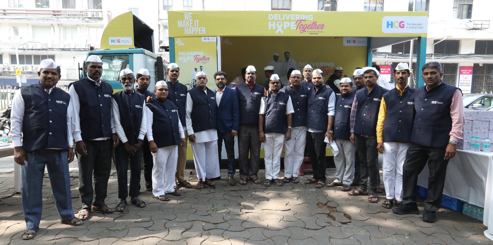 HCG Cancer Care Centre x Dabbawala's participating in creating awareness about prostate cancer by wearing blue jackets 